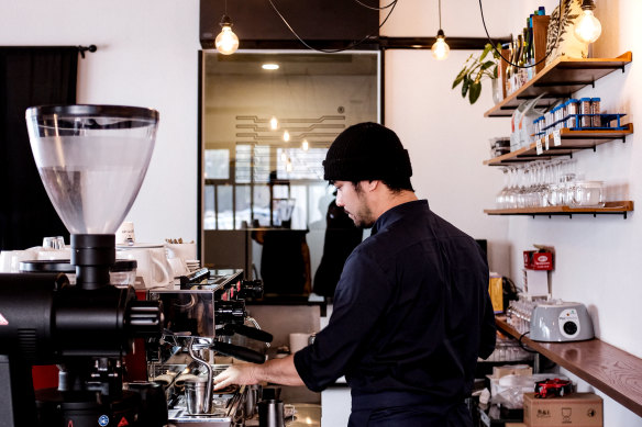 Owner and founder Arnun Wattanaporn behind the counter at Kaizen.