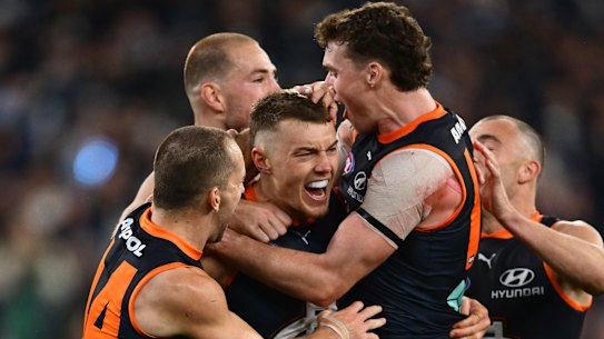 Patrick Cripps was mobbed by teammates after slotting the match-winning goal.