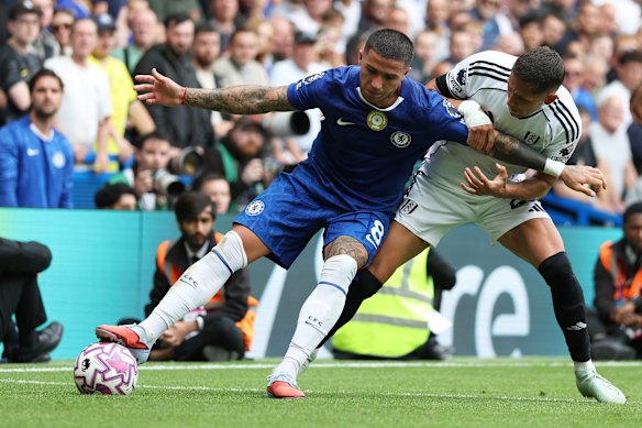 Chelsea’s Enzo Fernandez, left, duels for the ball with Fulham’s Sasa Lukic.