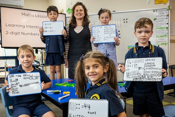 Teacher Lidia Cummins with students at Bentleigh West Primary, where maths is taught in an explicit, systematic way. The school’s NAPLAN results are among the best in the state.