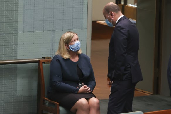 Archer speaks with then-treasurer Josh Frydenberg in 2021, after she crossed the floor to allow debate on an integrity commission bill.