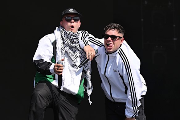 The group Kneecap, two thirds pictured here at Glastonbury with Mo Chara on the left, are also subject to the investigation.