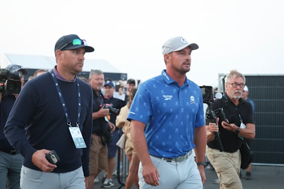 Bryson DeChambeau of the United States and his agent Brett Falkoff on a controversial evening at the British Open. 