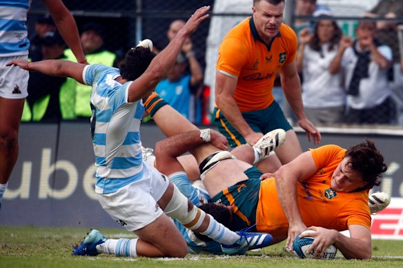 Tom Hooper of the Wallabies scores a try.