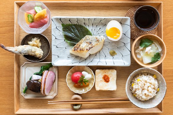 The Japanese breakfast set includes grilled fish, rice, soup, something fried, something grilled, a little sashimi and pickles.