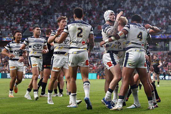 The Cowboys celebrate a try on Friday.