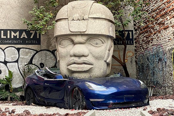 Sculptor Chavis Marmol’s work  of Mesoamerican civilisation crushing a Tesla. 