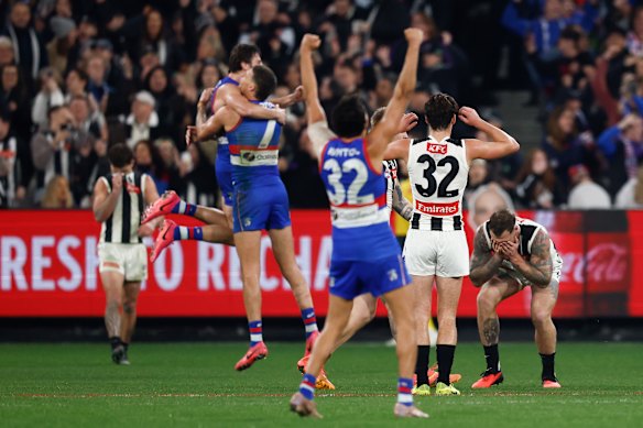 Bulldogs players celebrate after Tim Membrey missed an after-siren kick that would have put Collingwood into an elimination final.