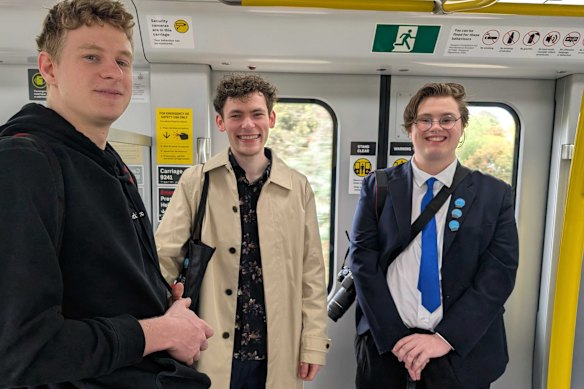 Jackson Davis (right), Matthew Boldiston (centre) and Adam Bain were collecting new station pins on Sunday.