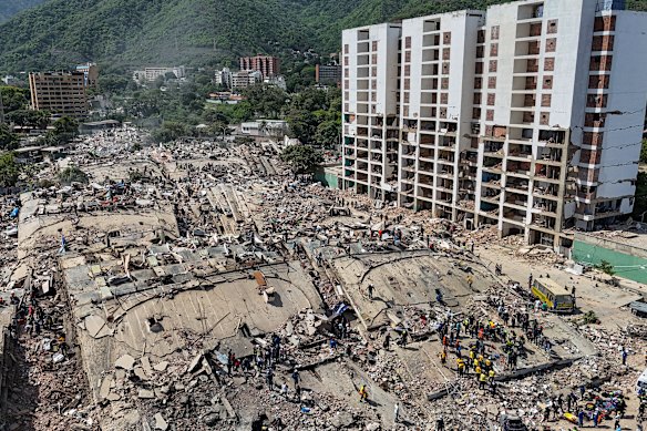 Rescue teams working amid devastation in Caraballeda on Sunday. 