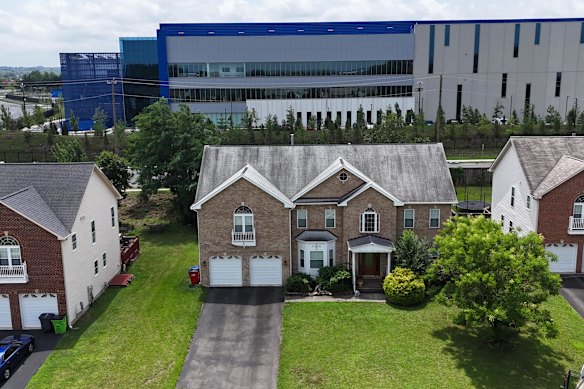 Homes behind the Vantage Data Centre facility in Sterling, Virginia, which has the world’s highest concentration of data centres.