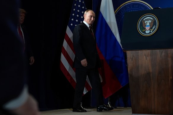 Donald Trump and Vladimir Putin arrive for a press conference after their meeting in Alaska on August 18.
