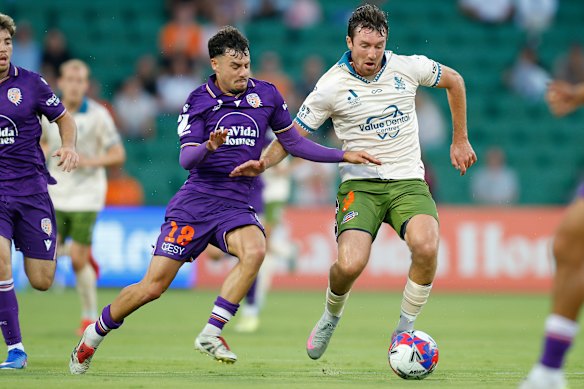 Christopher Long of the Roar runs with the ball across the ground during the round 13 A-League Men match between Perth Glory and Brisbane Roar at HBF Park.