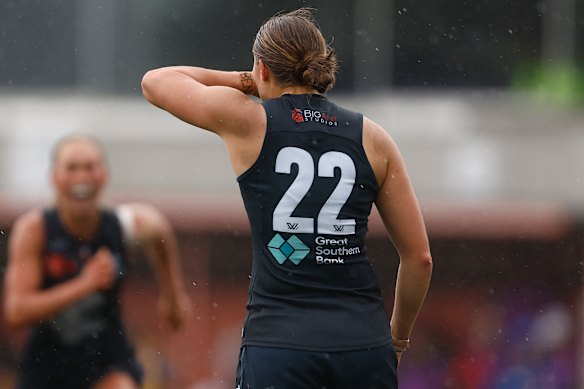 Mia Austin of the Blues pays tribute to her cousin Ben Austin, who died last week, after she kicked a goal against West Coast.