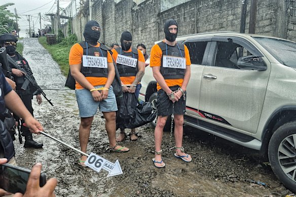 All three co-accused men during the re-enactment.