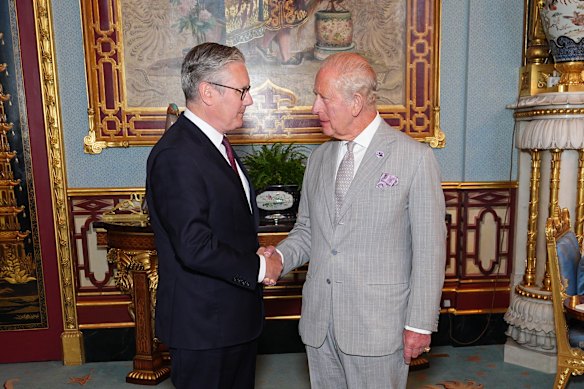 King Charles welcomes Starmer to Buckingham Palace, where he officially resigned as PM.