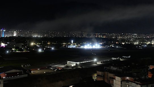 Smoke raises at La Carlota airport after explosions and low-flying aircraft were heard in Caracas.