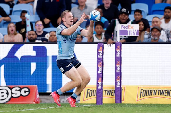 Max Jorgensen of the Waratahs runs in to score a try 