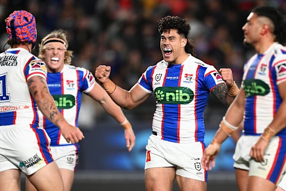 Knights players celebrate during the win.