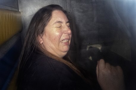 Erin Patterson in the back of the prison van on May 12.