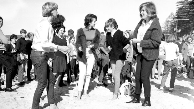 Spectators pictured on the final day of the 1964 World Surfboard Championships at Manly Beach. 