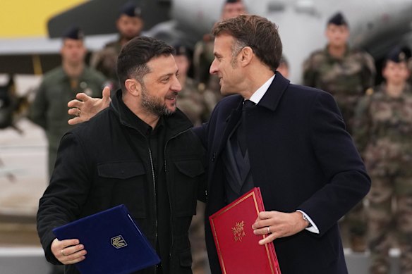 Zelensky (left) is set to meet French leader Emmanuel Macron again on Monday.