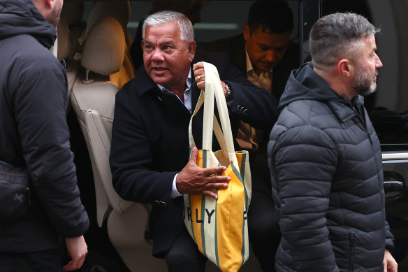Kerr’s father, Roger, arrives at court.