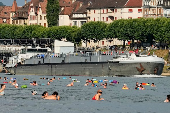 People seek relief from the heat in the River Rhine in Basel, Switzerland. 