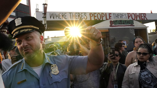 Minneapolis Police Chief Brian O’Hara raises his fist in solidarity