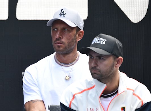 Aryna Sabalenka’s boyfriend Georgios Frangulis, left, sits courtside on Rod Laver Arena.