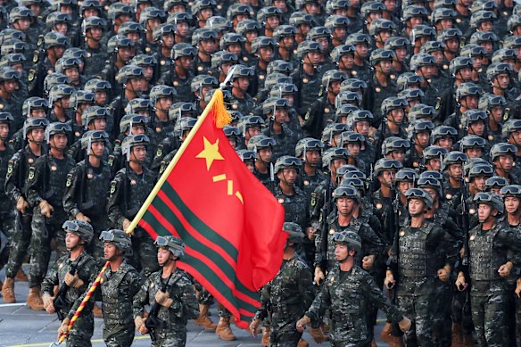 Military personnel take part in a military parade to commemorate the 80th anniversary of the end of WWII. 