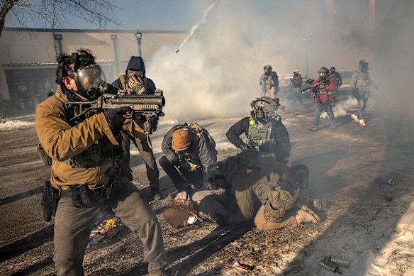 Federal agents confront protesters in Minneapolis.