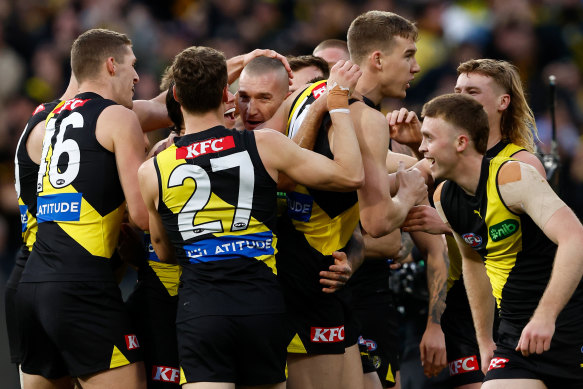Dustin Martin of the Tigers celebrates a goal with teammates.