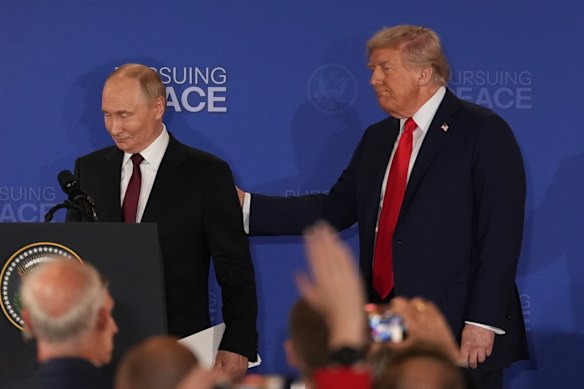Vladimir Putin and Donald Trump leave a press conference at the end of their meeting in Alaska.