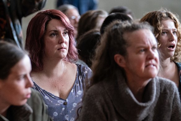 Melanie Lynskey in a scene where families are told the men are dead.