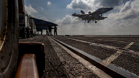 An EA-18G Growler landing on the flight deck of the USS Abraham Lincoln in the Indian Ocean.