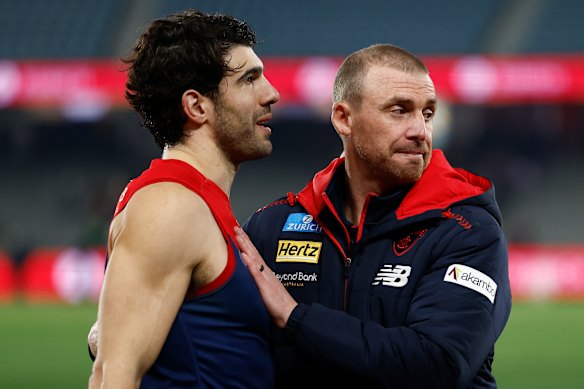 Christian Petracca is embraced by Simon Goodwin after their side’s win over the Eagles.