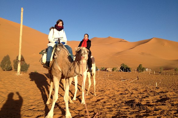 Margot Saville and her daughter Stella on the camels (which spit, a lot).