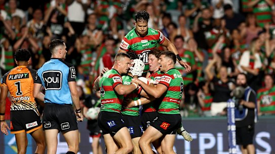 The Rabbitohs celebrate a try against the Tigers in Gosford.