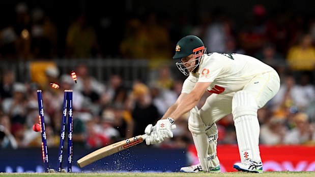 Brydon Carse bowls Australia’s all-rounder Cameron Green in a reckless period of batting in Brisbane.