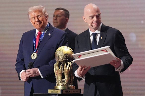 President Donald Trump receives the FIFA Peace Prize from FIFA President Gianni Infantino during the draw for the 2026 soccer World Cup earlier this month. 