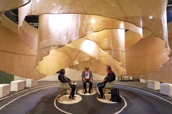 WHO summit attendees meditating
in one of the exhibition areas.