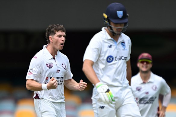 Hayden Kerr celebrates after dismissing Sam Konstas in the Queensland v NSW Shield game.