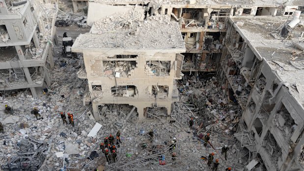 Soldiers search for trapped people after the overnight missile strike in Bat Yam.