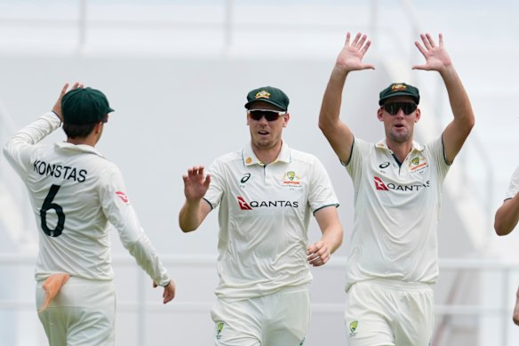 Australia’s Cameron Green, centre, celebrates with Beau Webster, and Sam Konstas. 