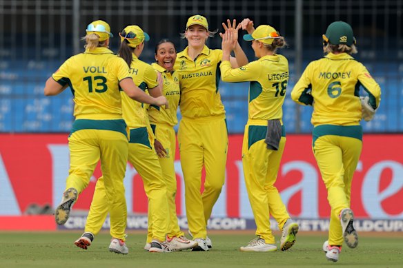Alana King celebrates with teammates after taking the wicket of Nat Sciver-Brunt of England.