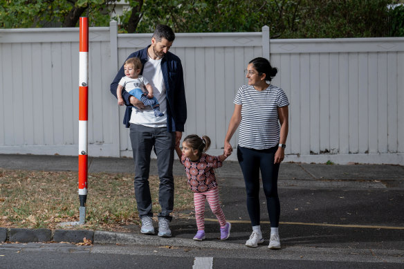 Claire Courtis-Petrusev and Iggy Courtis with their children, Rosa and Wilbur, near Surrey Hills Primary School.