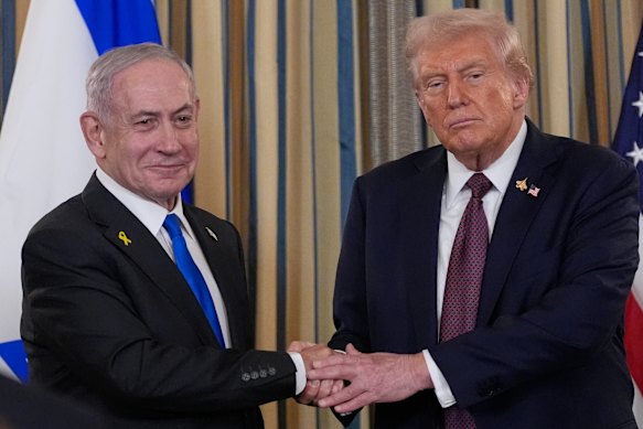 Israel’s Prime Minister Benjamin Netanyahu shakes hands with US President Donald Trump after a news conference in the State Dining Room of the White House on Monday (Tuesday AEST). 