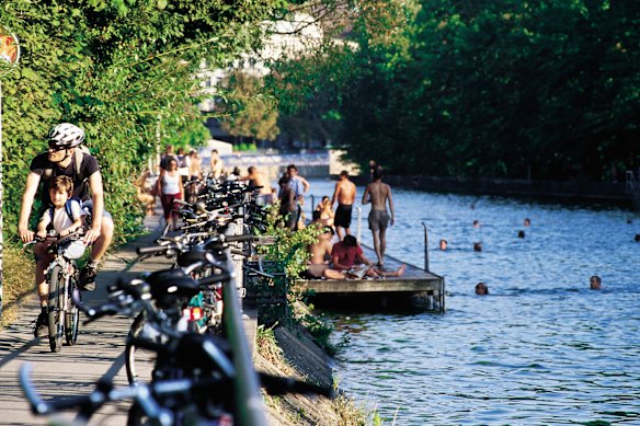 Join locals enjoying Zurich’s Limmat River, a popular spot for bathing and recreation.
