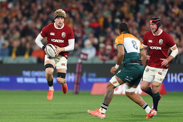 Henry Pollock of British & Irish Lions runs with the ball against AUNZ.